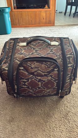 Snake print luggage