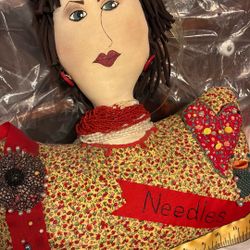 Doll, needle, and pin cushion holder
