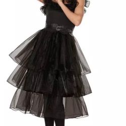 Wednesday Addams’ dark and elegant style with this brand new gothic black layered dress! This stunning costume features dramati