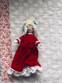 Porcelain Doll in Red Velvet Dress