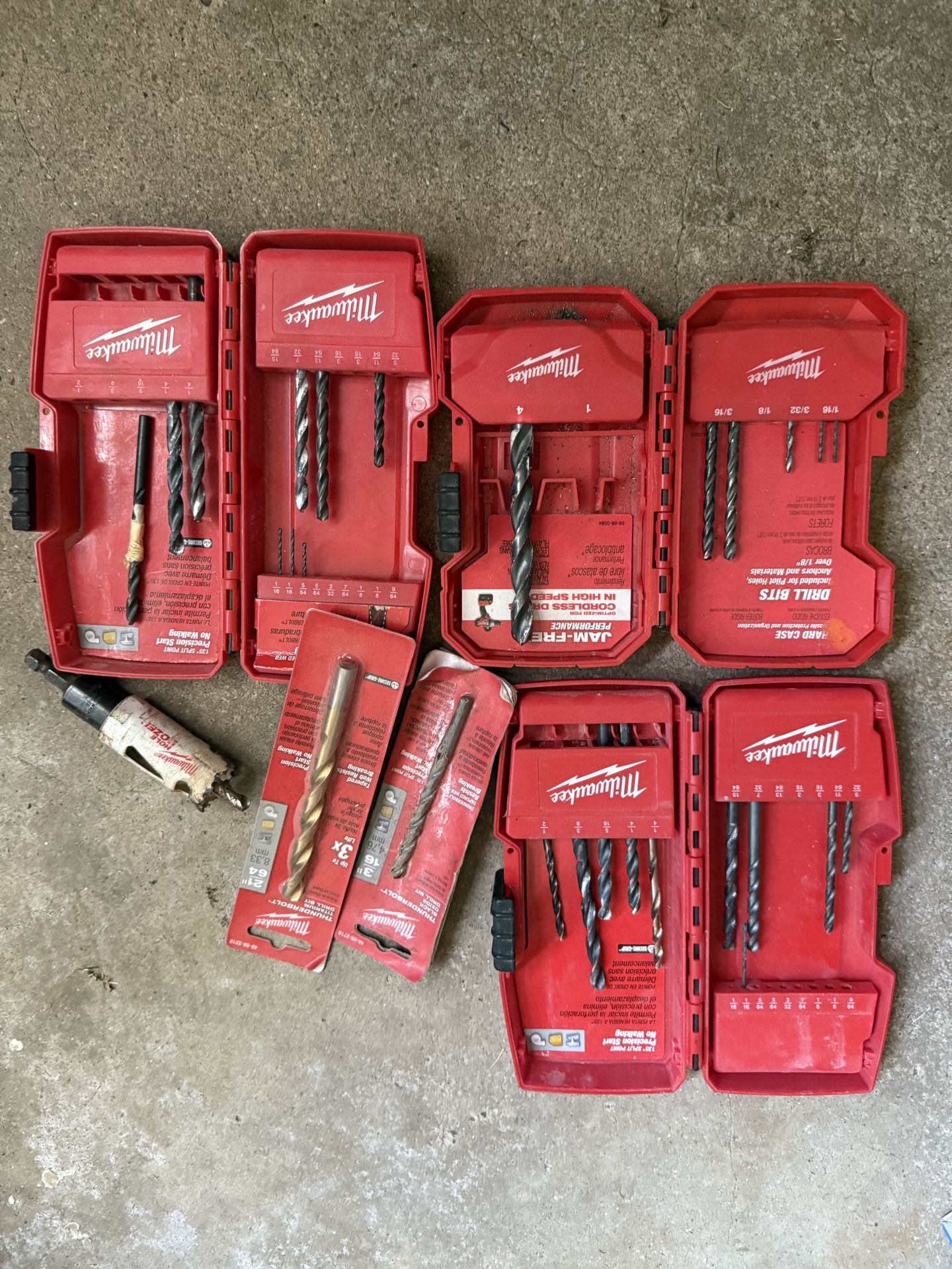 Milwaukee 25 misc different size drill bits and cases, $40 or OBO for all or you can buy anything separate,