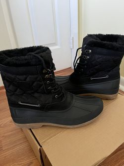 Durable snow boots with a cozy fur lining. Lace-up design for secure fit. Ideal for cold weath 