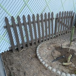 Gothic wood fence painted brown