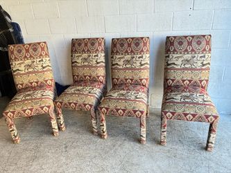 Gorgeous, set of four upholstered dining chairs, imported fabric, animal motif, great condition minor wear around the folds on the top. The chairs mea