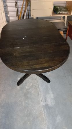 Solid Wood Table With Fold Down Leaves.