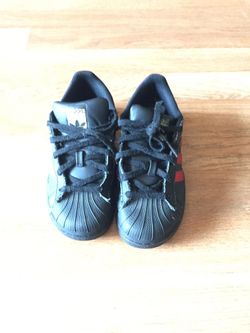 Black with red stripes superstar adidas shoes