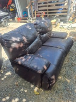 Brown leather reclining love seat scratched (FREE)