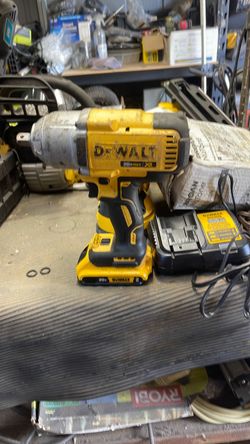 Half inch Dewalt impact gun with battery and charger Half inch Dewalt impact gun with battery and charger