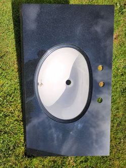 Black granite countertop with under mount sink