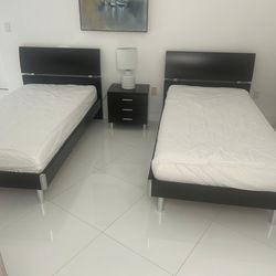 Two twin beds and one nightstand