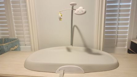 Grey Skip Hop diaper changer and grey Diaper Genie