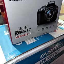 Canon EOS Rebel T7 DSLR Camera with an EF-S 18-55mm IS II lens kit.  