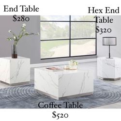 White Marble With Silver Accent Trim Brand New In Box Each Item Sold Separately Coffee Table $520 End Table $280 Hex End Table $320 Financing Avail.