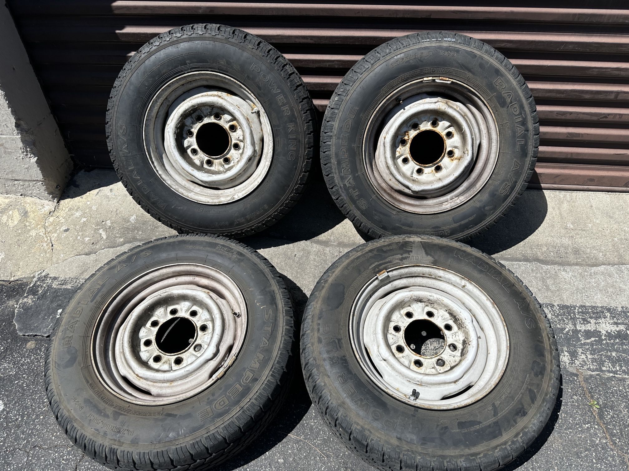 16.5 inch stock steelies with old tires 8 lug GMC or Chevy rollers 