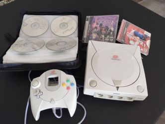 Sega Dreamcast console with games