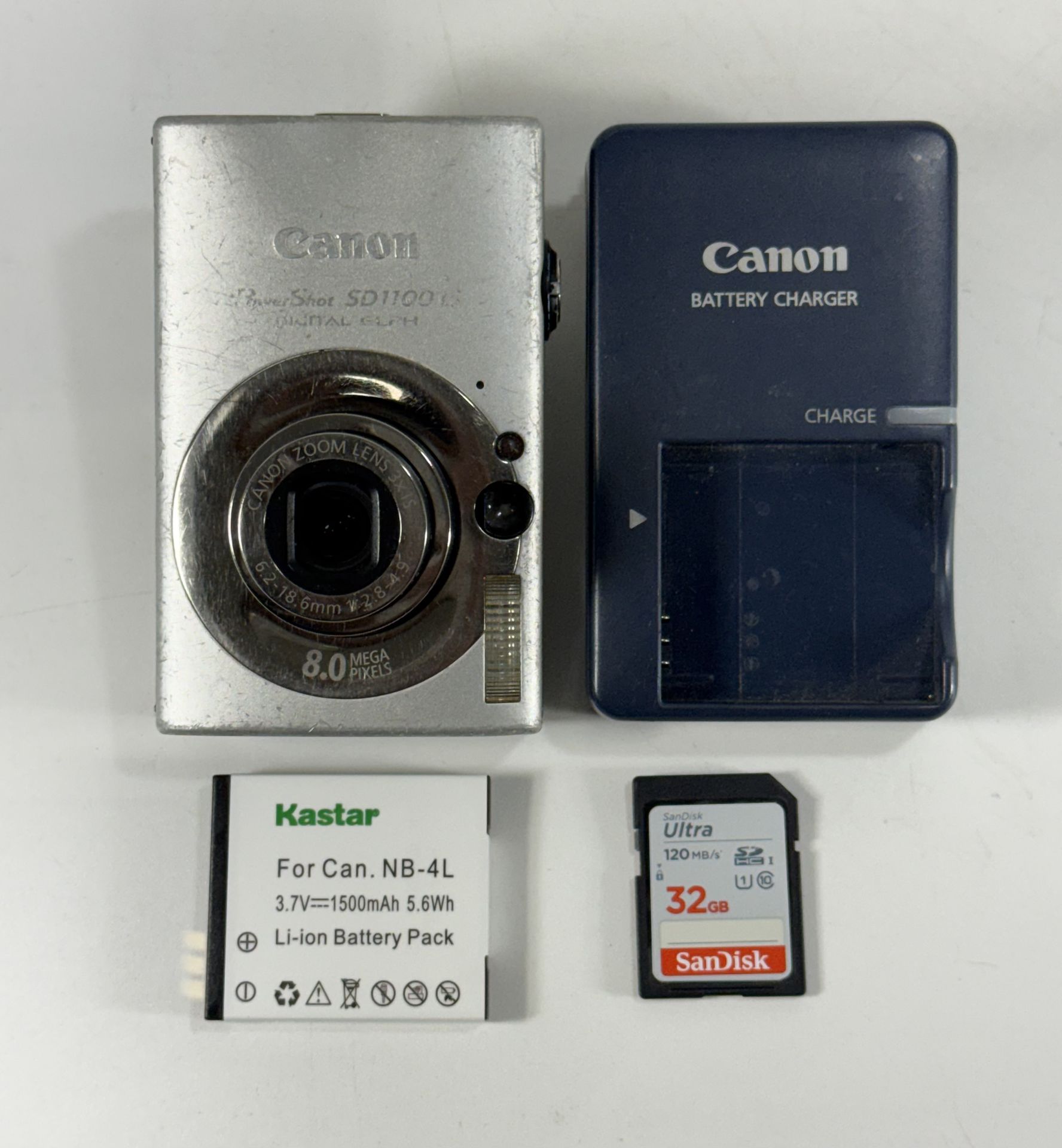 Canon PowerShot SD1100 IS ELPH Silver 8MP Digital Camera with 32GB Memory