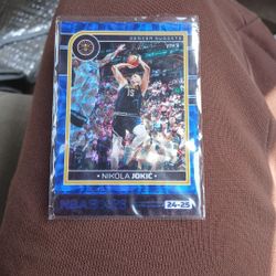 Nikola Jokic   No.12  with Penny Sleve 