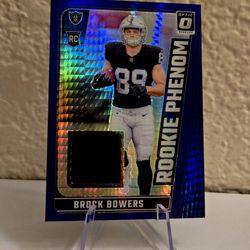 Brock Bowers 2024 Donruss Optic Rookie Phenom Blue Hyper Mem Relic