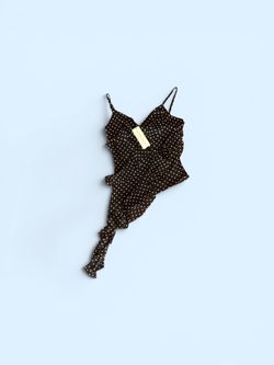 Black polka dot asymmetrical top with ruffles