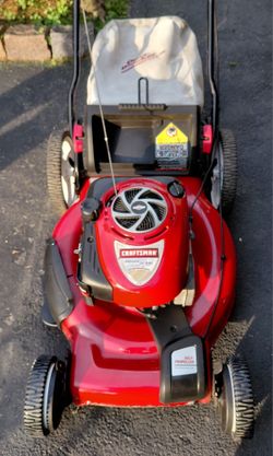 CRAFTSMAN LAWN MOWER WITH WORKING SELF PROPELLED THAT RUNS GREAT.