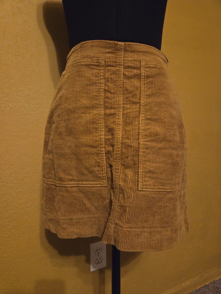 Uniqlo corduroy mini skirt with patch pockets in a mustard yellow