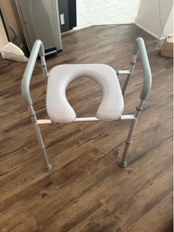 Raised toilet seat