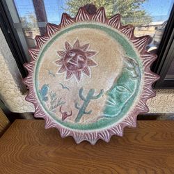 hand-painted Mexican Talavera ceramic sun and moon wall hanging. 