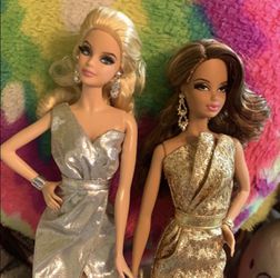 Blonde and African American Barbie dolls
