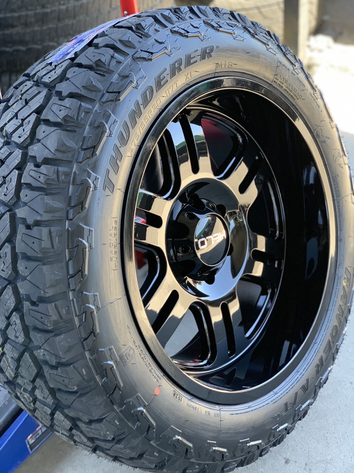 20x10 All gloss black rim and AT rugged terrain tires 6 lug Chevy gmc Nissan Toyota 2755520