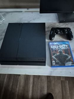 PS4 Console with Controller and Game