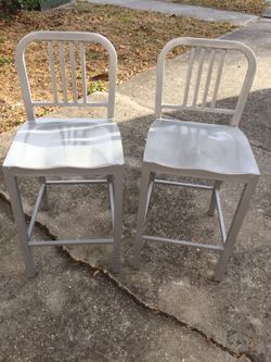 Two silver/ grey highback metal chairs
