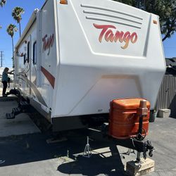 Tango RV Trailer 34 Foot two bedrooms, spacious bathroom, two entrance doors good condition clean title everything works electric Awning .