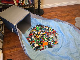 Various Legos and other blocks in Sam and Mabel Storage Box