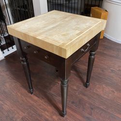 A square butcher block table/island