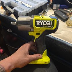BRAND NEW!!!RYOBI impact drill with battery in charger 