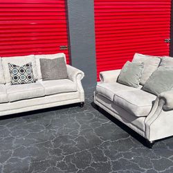 GRAY FABRIC SOFA AND LOVESEAT by ARIA DESIGNS - delivery is negotiable