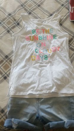 Cute colorful shirt for little girls with part of shorts. Size shirt is 10/12 pair 10