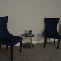 Two Royal Blue Chairs And Small Table