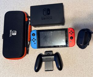 Nintendo Switch with travel case, controller, docking station, and power adaptor