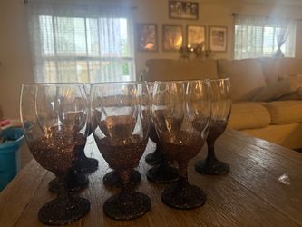 10 black and Roswell gold glasses