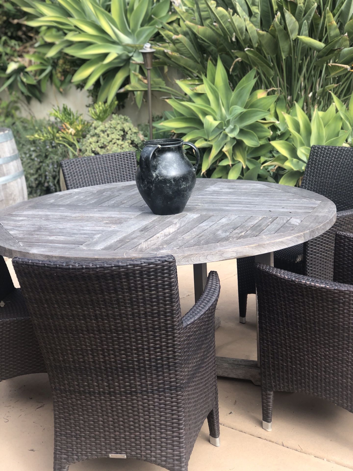 59 inch teak table with 6 outdoor rattan chairs 3 with arms and 3 with out