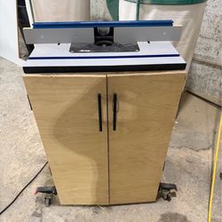 Kreg router table with router and custom cabinet on casters