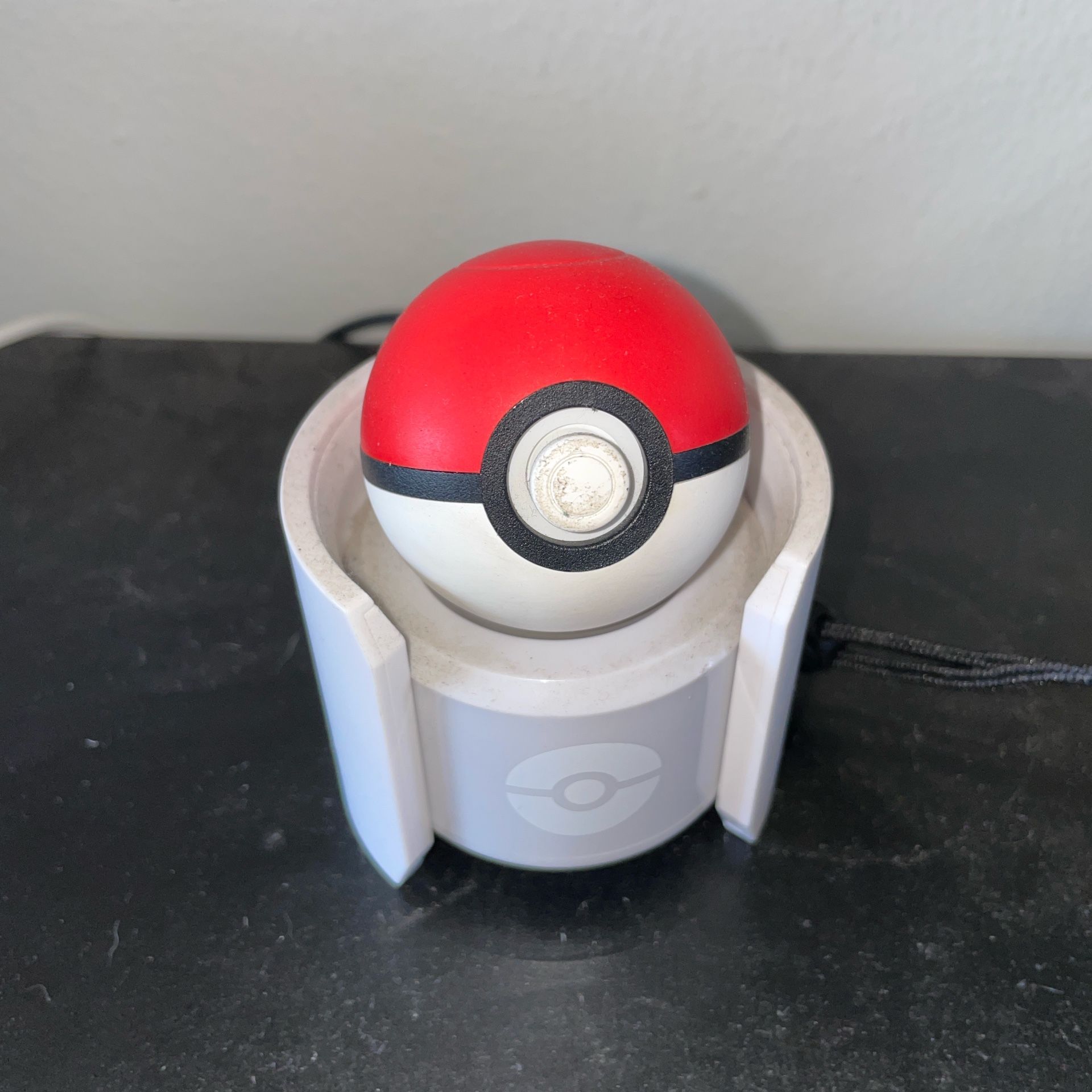 Poke Ball And The Charging Stand