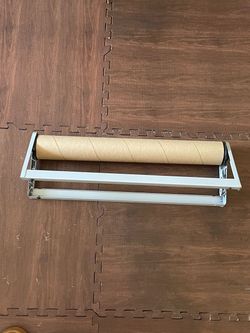Paper roll dispenser and cutter