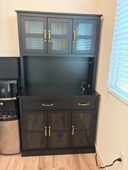 Black kitchen hutch with charging station & glass doors