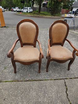 This is a Louis XV style cabriolet armchair. Based on the details provided from the tags in your previous image, it is a high-quality, modern reproduc