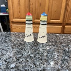 Ceramic Newport, Rhode Island Lighthouse Pair of Salt and Pepper Shakers.  Size approximately 4 inches tall.  Preowned.  