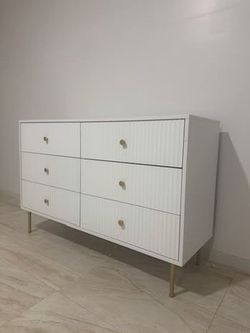 Modern White 6-Drawer Dresser – $120 ✨ Price: $120  Modern white dresser with gold handles and gold metal legs. Features 6 spacious drawers with plent