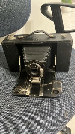 ntique Kodak Brownie folding camera from the early 20th century.