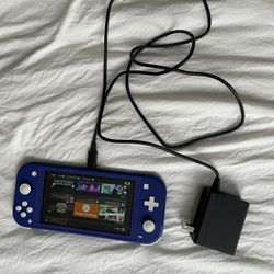 Nintendo Switch Lite And Charger 